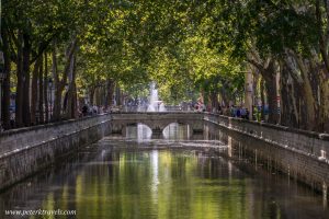 Quai de la Fontaine, the canal in the center of Nimes, France.